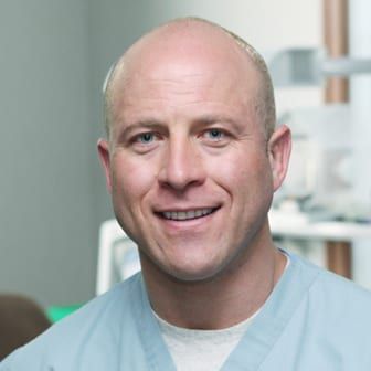 Dr. Shufflebarger in medical scrubs